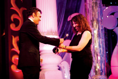 Sanjay Arora- MD, Dicitex Decor giving the award to Jasmin Sohrabji 
