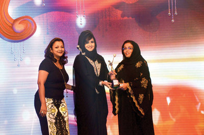 Sarita Menon (Marketing Manager- Khaljeet Times) and Sarah Belhasa to Dr. Maha Abdullah Al Muneef 