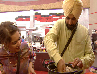 Sidhhu cooking with his chosen partner Aashka Goradia