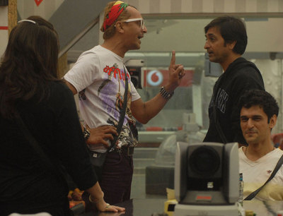 Imam argues with Rajev, while Niketan laughs at him