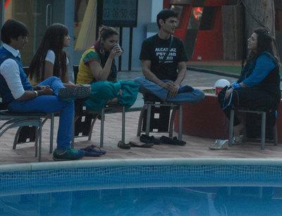 The housemates sit and talk