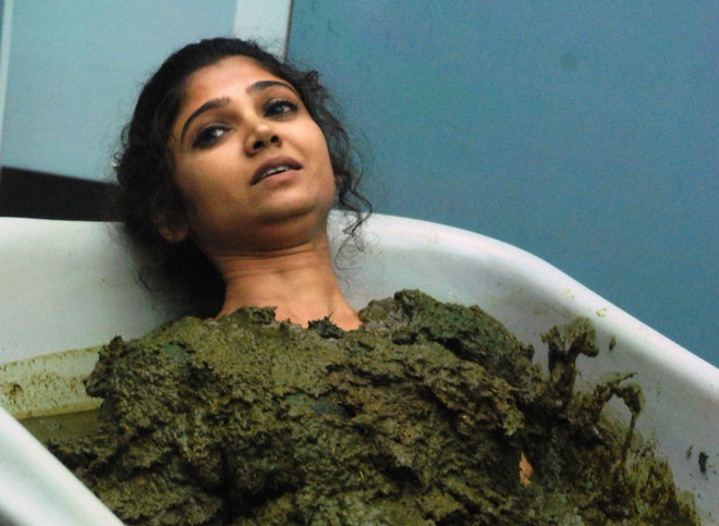 Ratan immersed in a tub full of cow dung