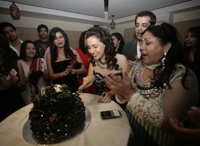 Pooja Joshi cutting the cake 