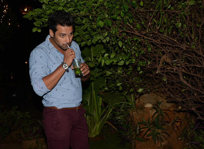 Nikkhil Chaddha sipping his drink